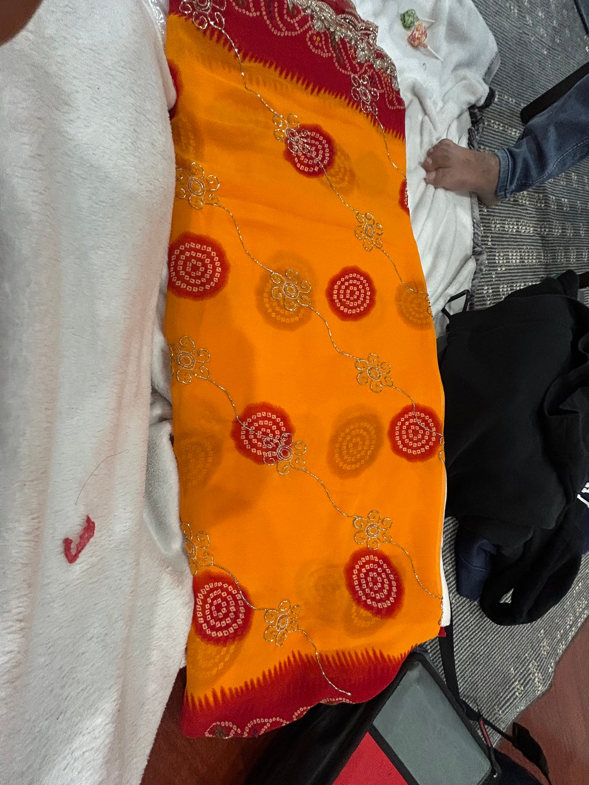 Yellow Bandhani Saree with Red Embroidered Border and Stitched Green Blouse